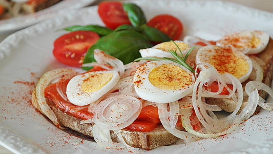 selective focus photography of plate of meat with boiled egg toppings thumbnail