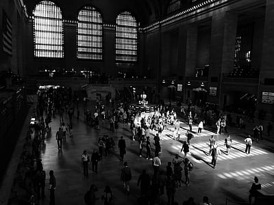 grayscale photography of people walking inside building thumbnail