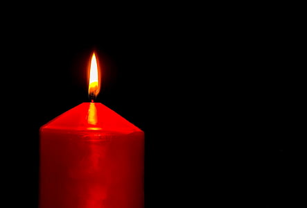 lighted red pillar candle thumbnail