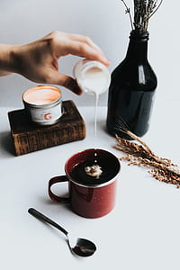 person pouring sugar on coffee thumbnail