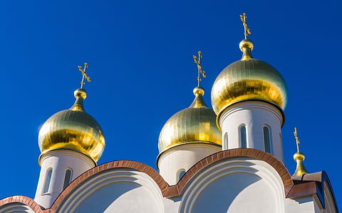 photo of white and brass concrete church thumbnail