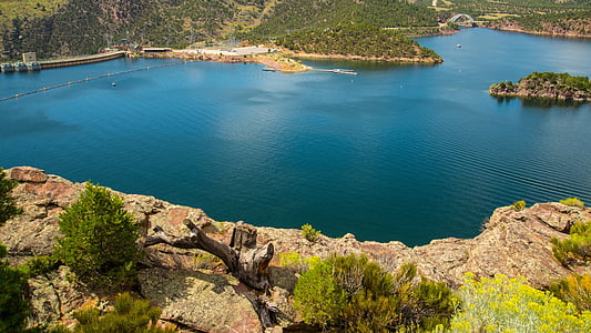 bird's-view photo of body of water near rock formations thumbnail