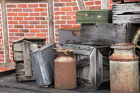 gray milk churn near assorted wooden box lot thumbnail