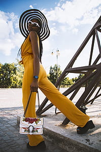 Woman Standing Beside Metal Structure thumbnail