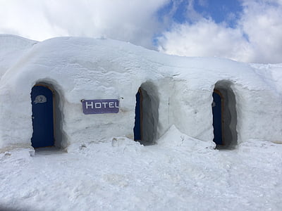 white snow Hotel with blue doors closed at daytime thumbnail
