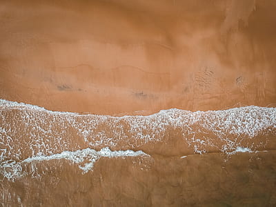 aerial photography of water waves during daytime thumbnail