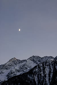 photography of mountain and moon thumbnail