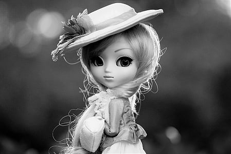 grayscale photo of girl doll thumbnail