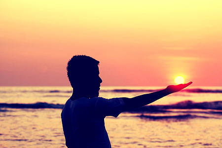 man wearing white shirt during golden hour thumbnail