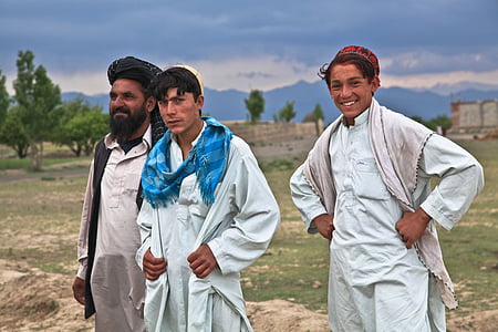 three man in white top standing near open field at daytime thumbnail