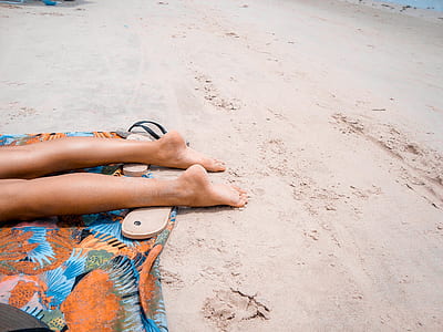 person laying on sand ground thumbnail