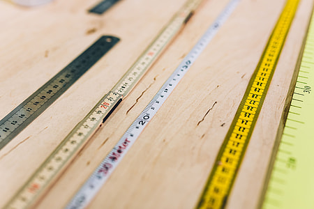 Close-ups of rulers on a wooden table thumbnail