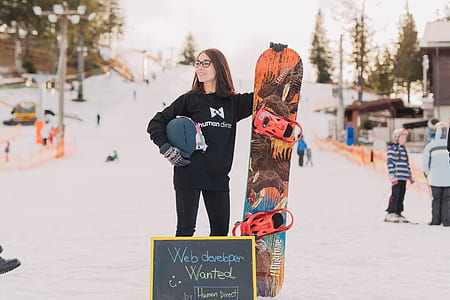 woman holding snowboard thumbnail