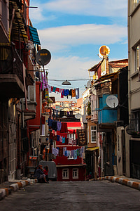 assorted clothes hanging on wire thumbnail