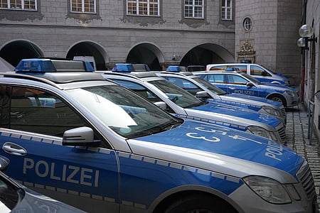 silver Polizei car in front of building thumbnail