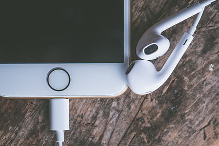 Closeup Photography of Iphone and Earpods thumbnail