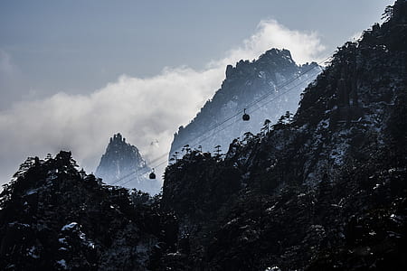 rocky mountain surrounded by clouds thumbnail