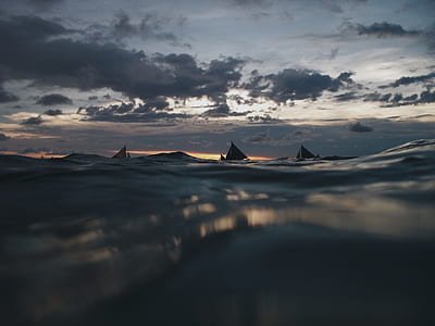 sailboat on water at night thumbnail