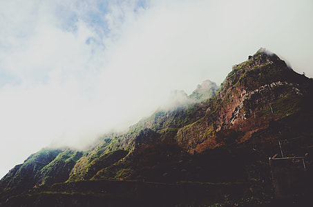 green and brown mountain with fog thumbnail
