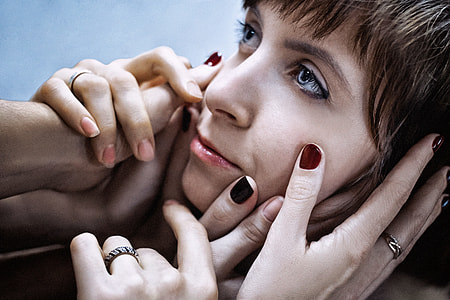 photo of hands touching woman's face thumbnail