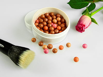 bowl of beads beside red rose thumbnail