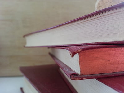 closeup photo of pile of books thumbnail