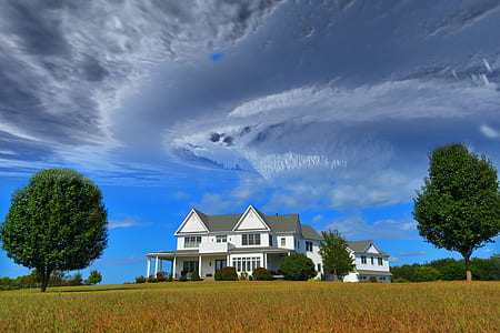 white house under blue sky during daytime thumbnail