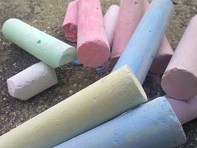 assorted-color board chalks on brown concrete surface thumbnail