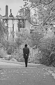 grayscale photo of person standing on street thumbnail