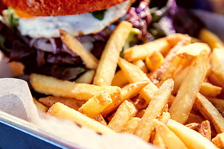 Detail of fries with hamburger at restaurant thumbnail