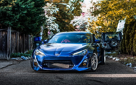 blue Toyota 86 parked on concrete road thumbnail