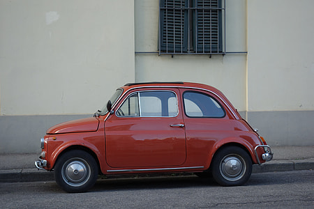 brown FIAT 500 3-door hatchback park near building thumbnail