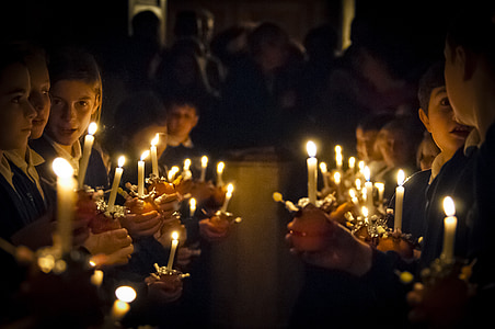 group of boy holding white candle thumbnail