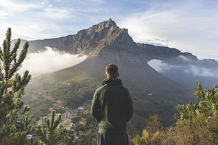 man standing on top of mountain thumbnail
