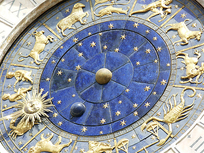 closeup photo of gold and brown zodiac signs embossed structure thumbnail