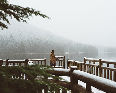 woman standing on wooden bridge thumbnail