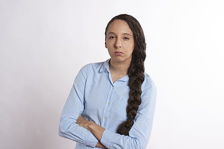 woman wearing blue dress shirt against white background thumbnail