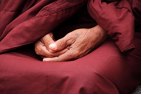 human hand on red textile thumbnail