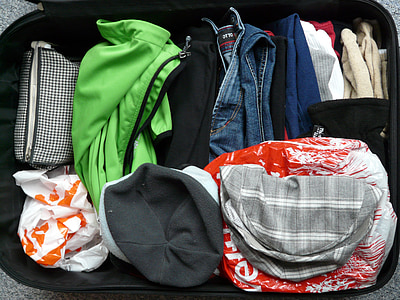 assorted-color clothes lot in luggage bag thumbnail
