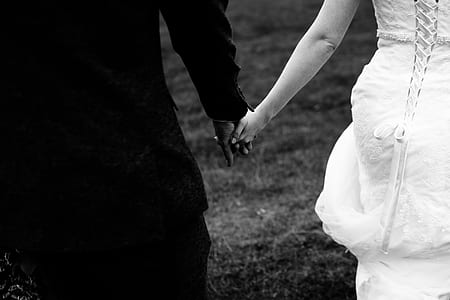 man and woman holding hands thumbnail