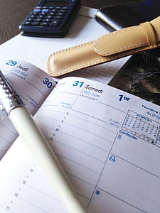white pen on white planner thumbnail