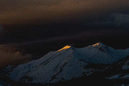silhouette of mountain covered by snow thumbnail