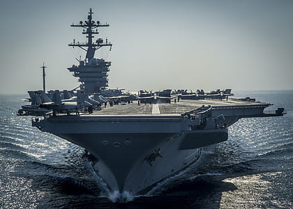 gray aircraft carrier in sea thumbnail