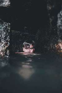 photo of man submerge in body of water thumbnail