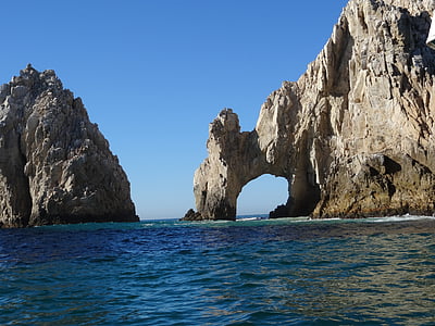 rocky island surrounded by water thumbnail