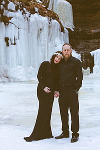 man and woman standing ice covered floor thumbnail