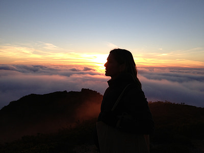 silhouette photography of woman surrounded by clouds thumbnail