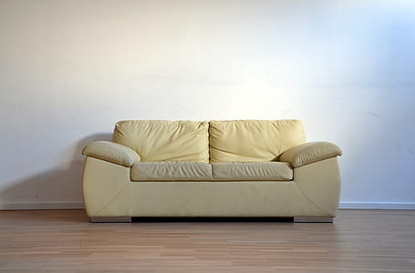white leather 2-seat sofa near wall thumbnail