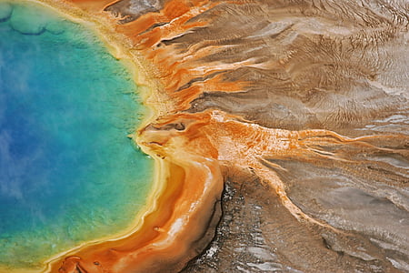 aerial photography of mountain near body of water thumbnail