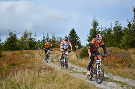 three man riding bicycles thumbnail
